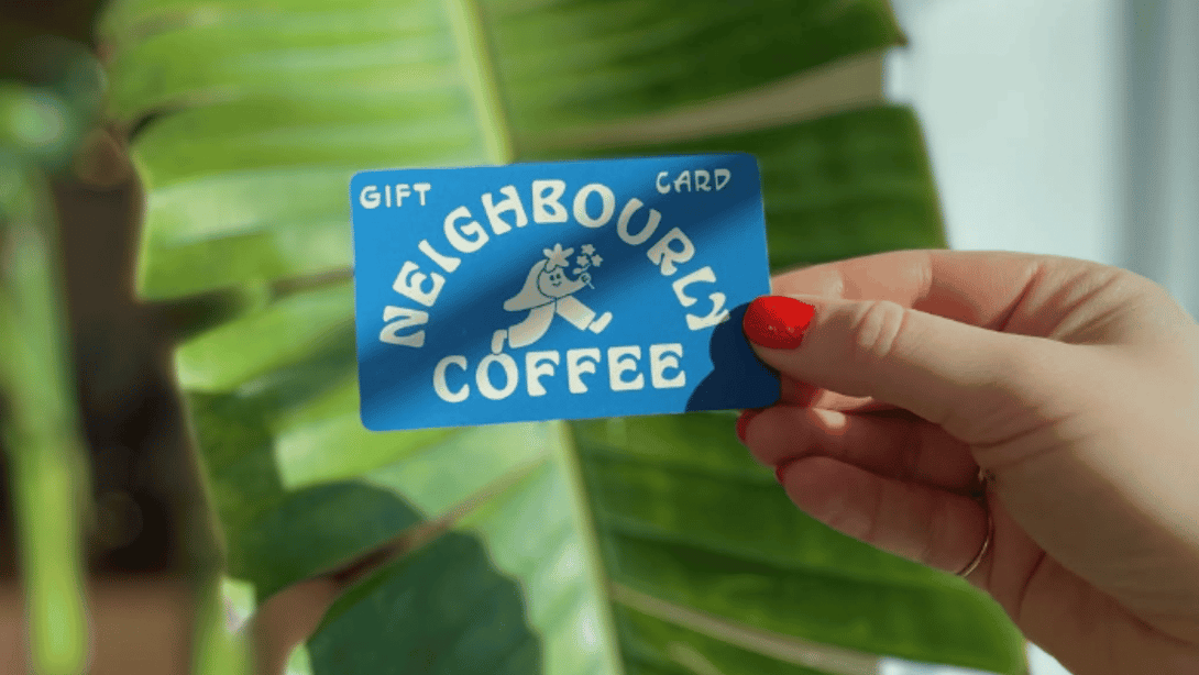 neighbourly coffee gift card in hand