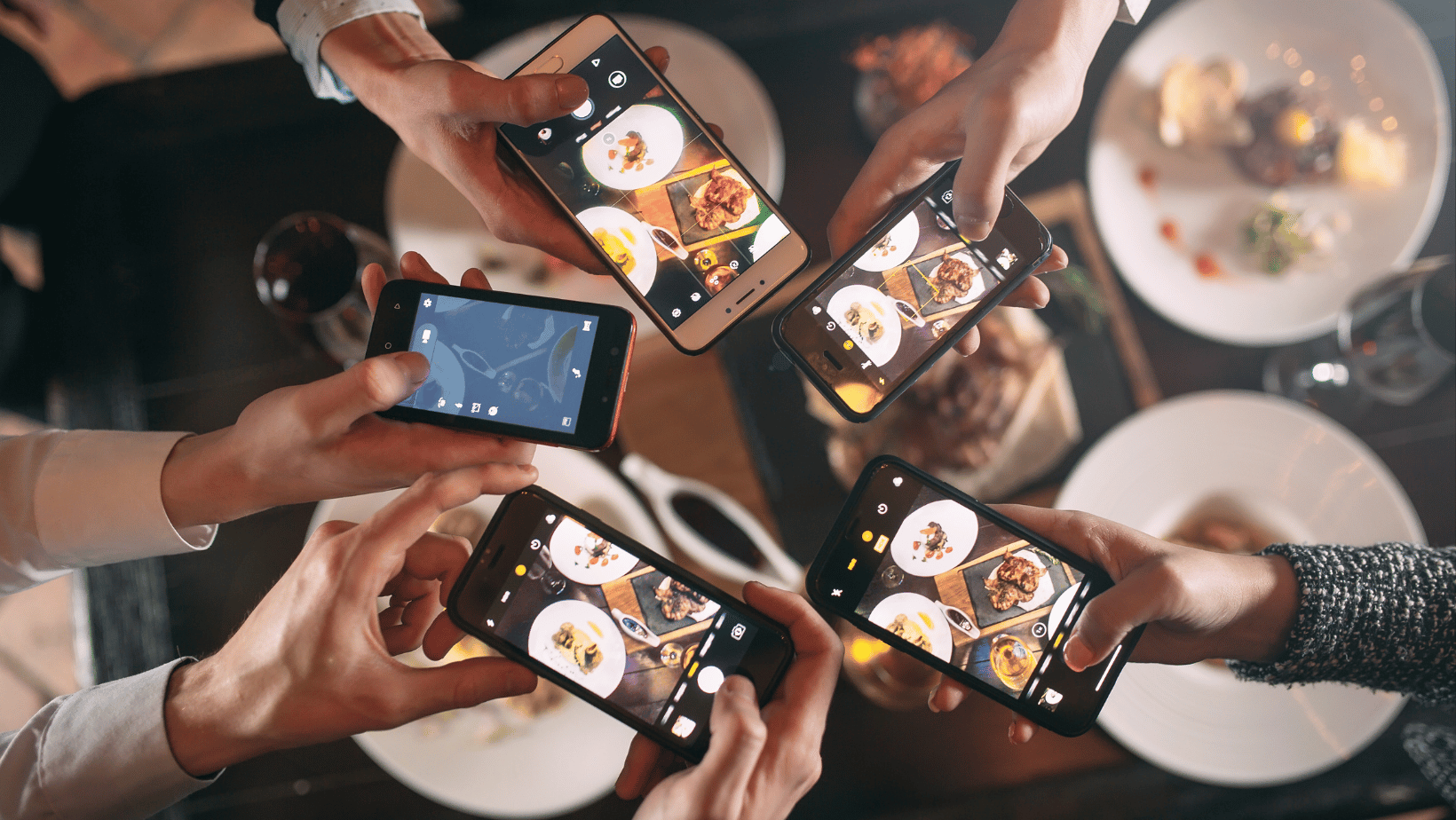 Group of Diners taking Photos for Social Media